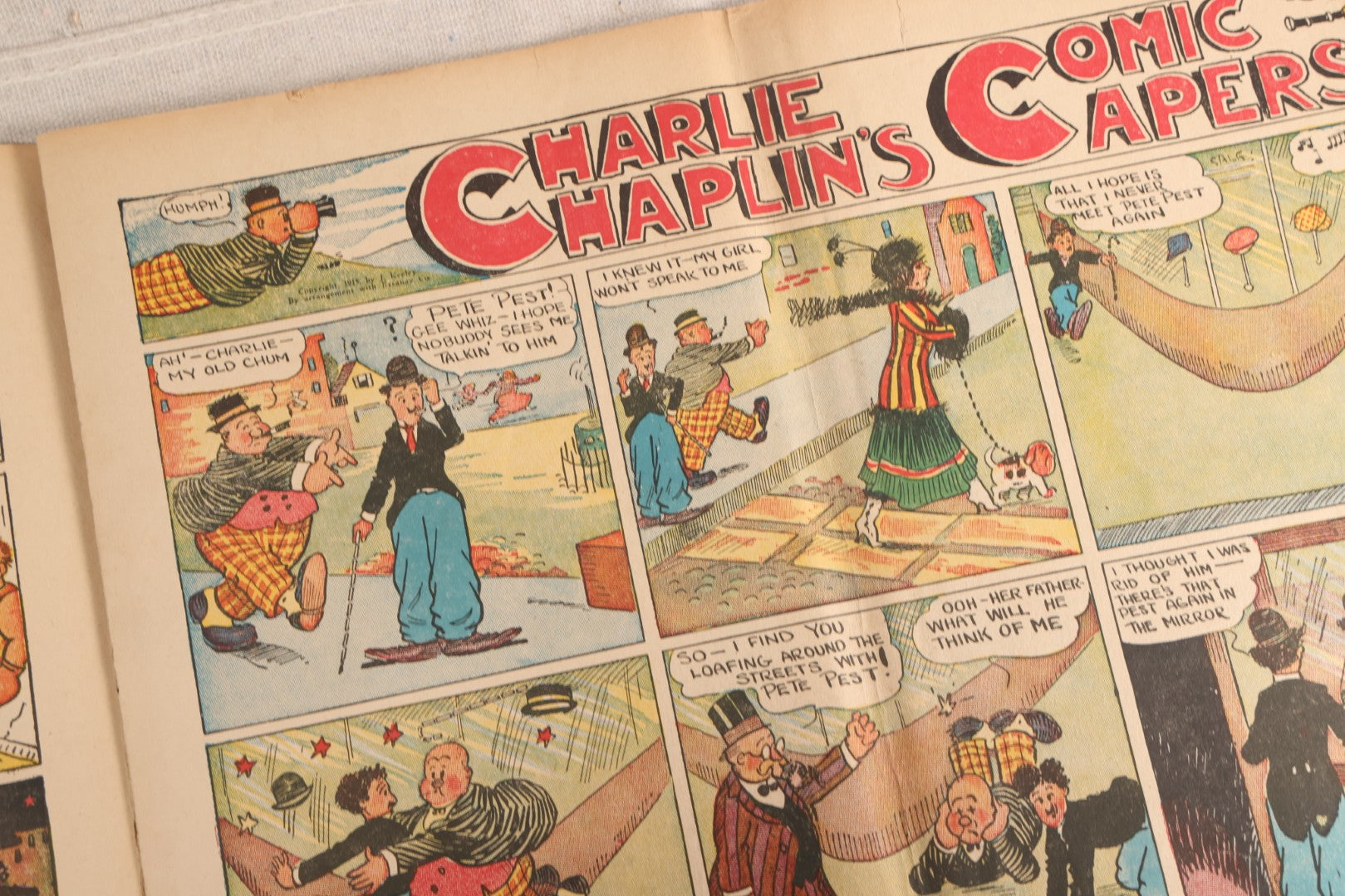 Lot 123 - "Charlie Chaplin's Funny Stunts" Antique Color Illustrated Comic Book, No. 380, Published By M. A. Donohue & Co., Chicago And New York, 1917, Note Large Fold Through Center