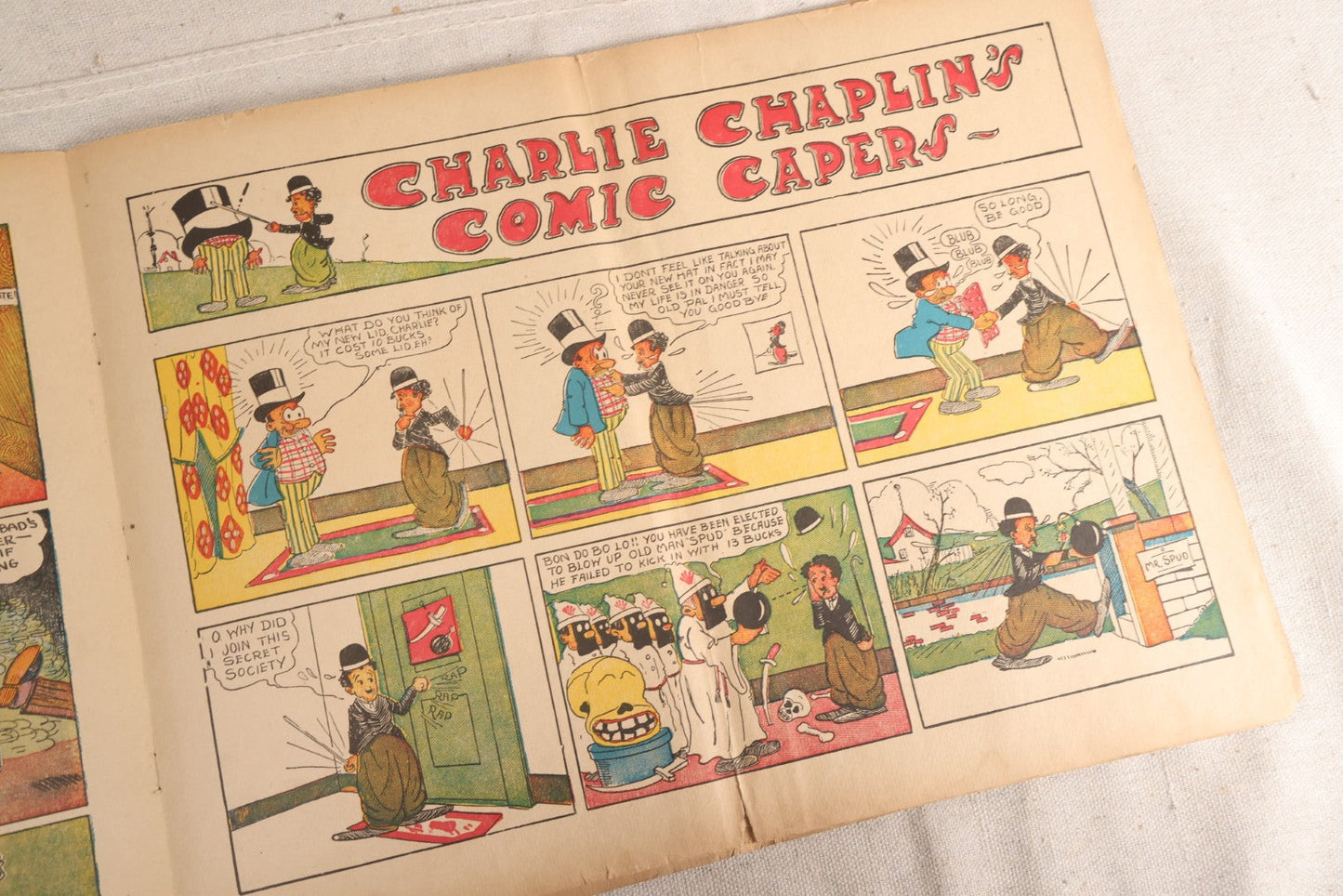 Lot 123 - "Charlie Chaplin's Funny Stunts" Antique Color Illustrated Comic Book, No. 380, Published By M. A. Donohue & Co., Chicago And New York, 1917, Note Large Fold Through Center