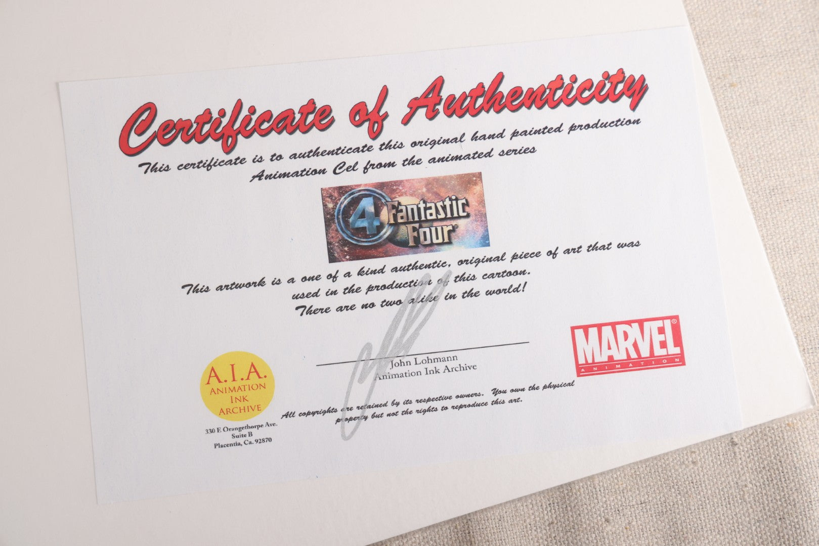 Lot 126 - Pair Of Vintage Marvel "Fantastic Four" Production Animation Cels, Human Torch And Mr. Fantastic With Painted Backgrounds, 1994-1996, A.I.A. Certificates Of Authenticity