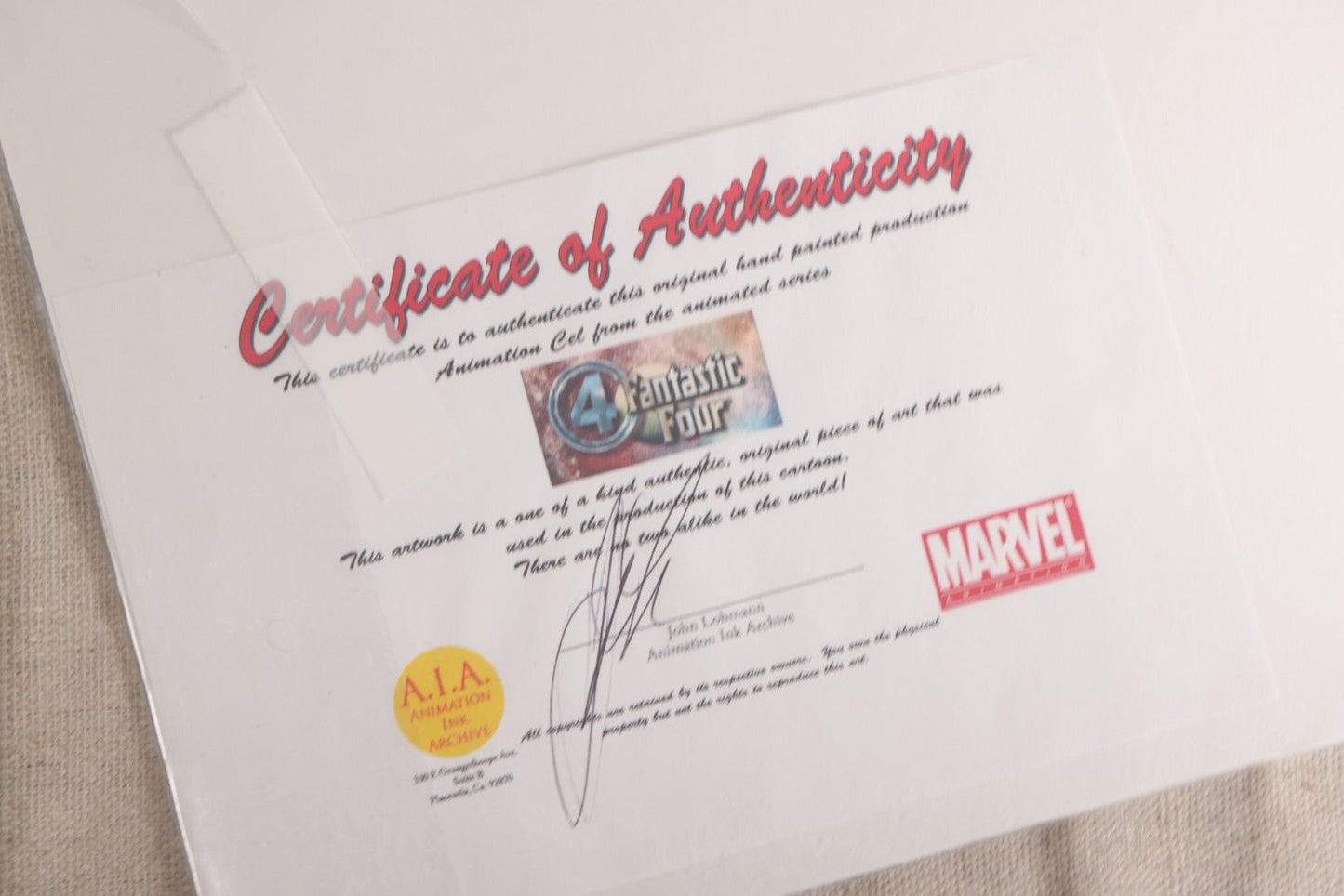 Lot 126 - Pair Of Vintage Marvel "Fantastic Four" Production Animation Cels, Human Torch And Mr. Fantastic With Painted Backgrounds, 1994-1996, A.I.A. Certificates Of Authenticity