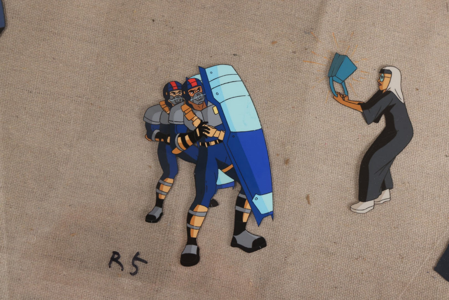 Lot 127 - Grouping Of Eight Vintage "Robocop: Alpha Commando" Production Animation Ephemera, Including Five Animation Cels, Production Sketch Drawing, Background, And Dope Sheet, 1998-1999, M.G.M. Animation