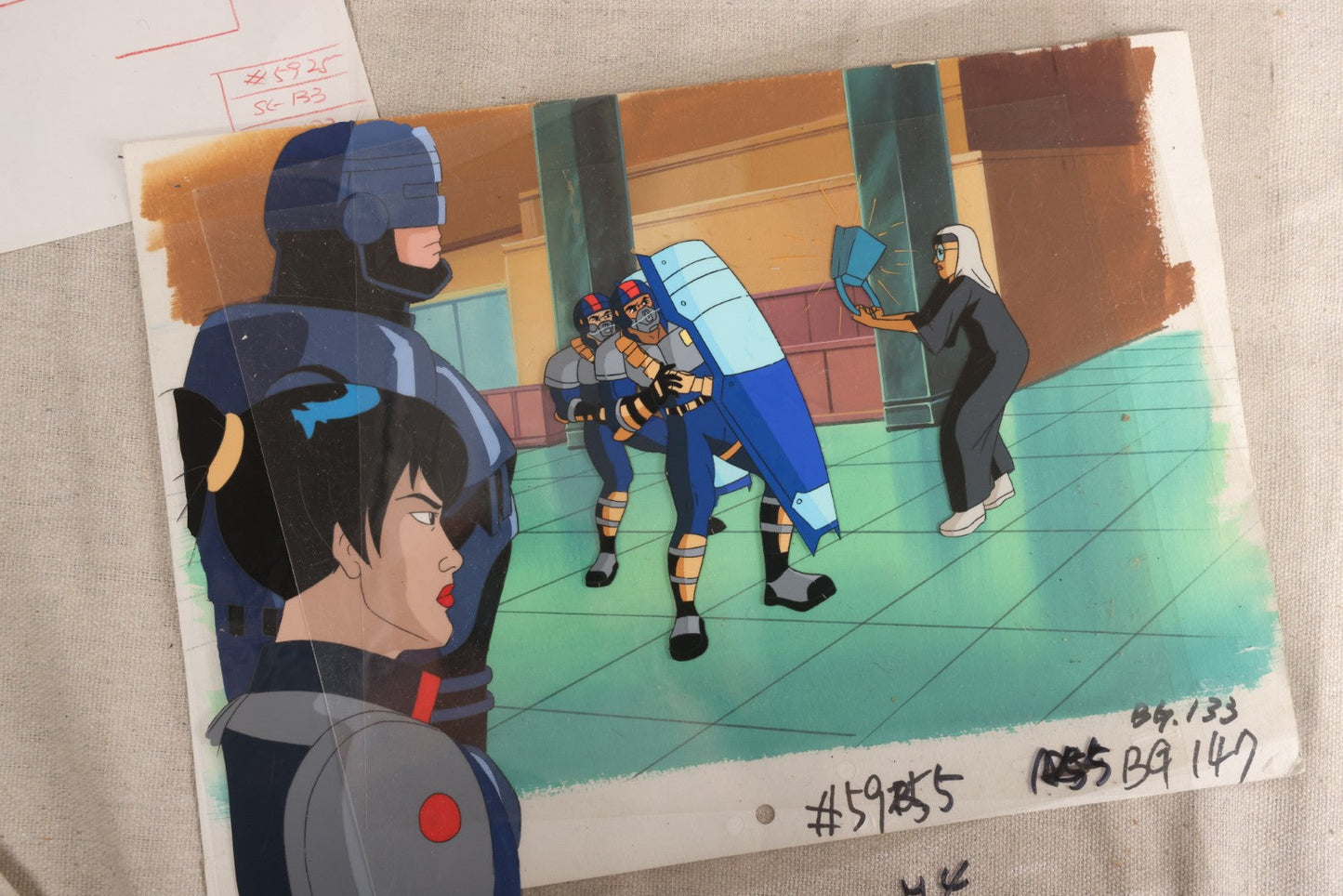 Lot 127 - Grouping Of Eight Vintage "Robocop: Alpha Commando" Production Animation Ephemera, Including Five Animation Cels, Production Sketch Drawing, Background, And Dope Sheet, 1998-1999, M.G.M. Animation