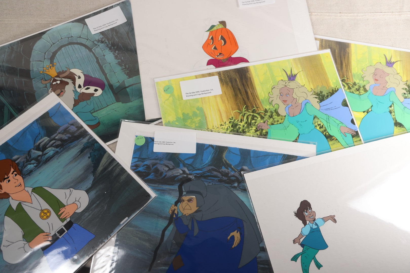 Lot 130 - Grouping Of 10+ Vintage "The Oz Kids" Production Animation Ephemera, Including Cels, Production Drawings, And Backgrounds, Hyperion Animation, 1996-1997