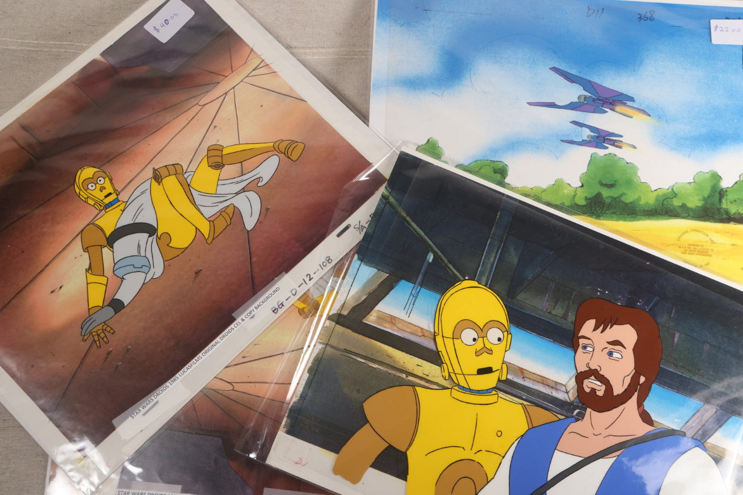 Lot 131 - Grouping Of 14+ Vintage "Star Wars: Droids" Production Animation Cels, Production Drawings, And Backgrounds, Nelvana/Lucasfilm, 1985-1986