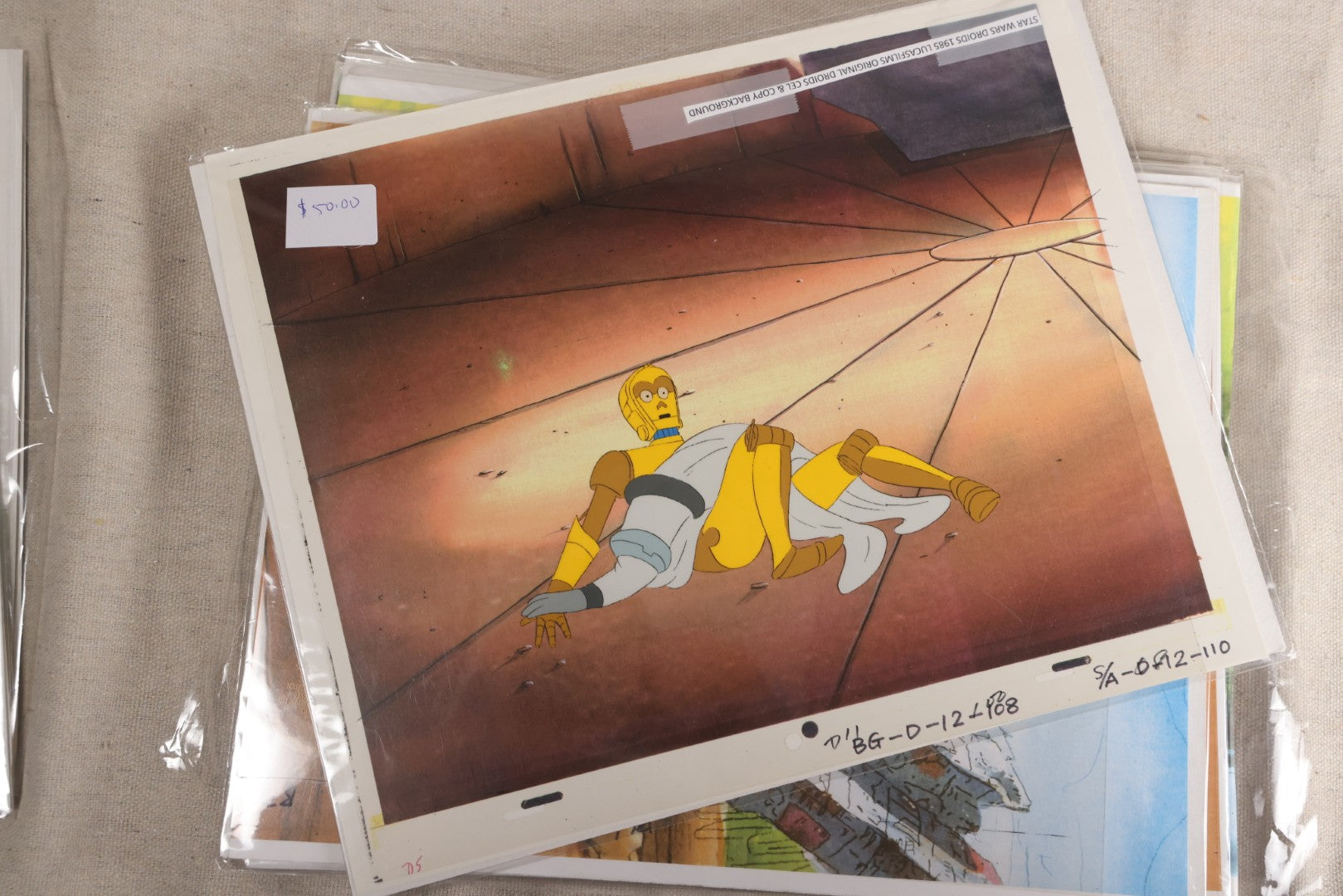 Lot 131 - Grouping Of 14+ Vintage "Star Wars: Droids" Production Animation Cels, Production Drawings, And Backgrounds, Nelvana/Lucasfilm, 1985-1986
