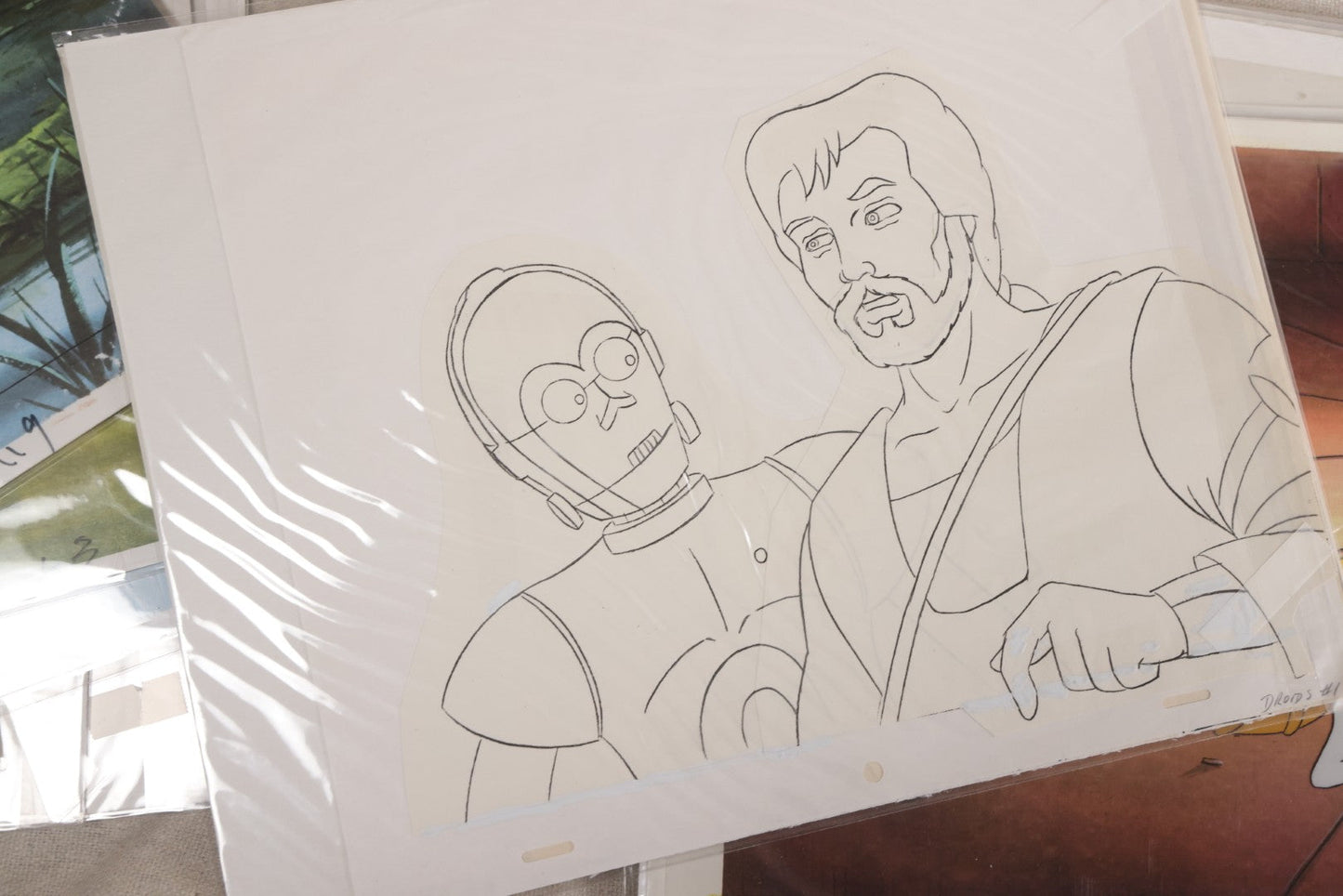 Lot 131 - Grouping Of 14+ Vintage "Star Wars: Droids" Production Animation Cels, Production Drawings, And Backgrounds, Nelvana/Lucasfilm, 1985-1986