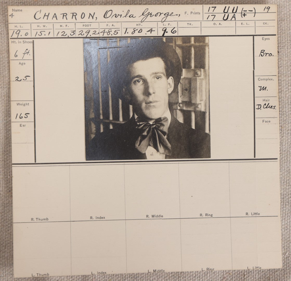 Lot 143 - Antique Real-Photo Police Mugshot And Arrest Card For Ovila George Charron, Aliases Geo. Dumas And John Miles, Arrested For Robbery, Fitchburg, Massachusetts Police Department, Circa 1910