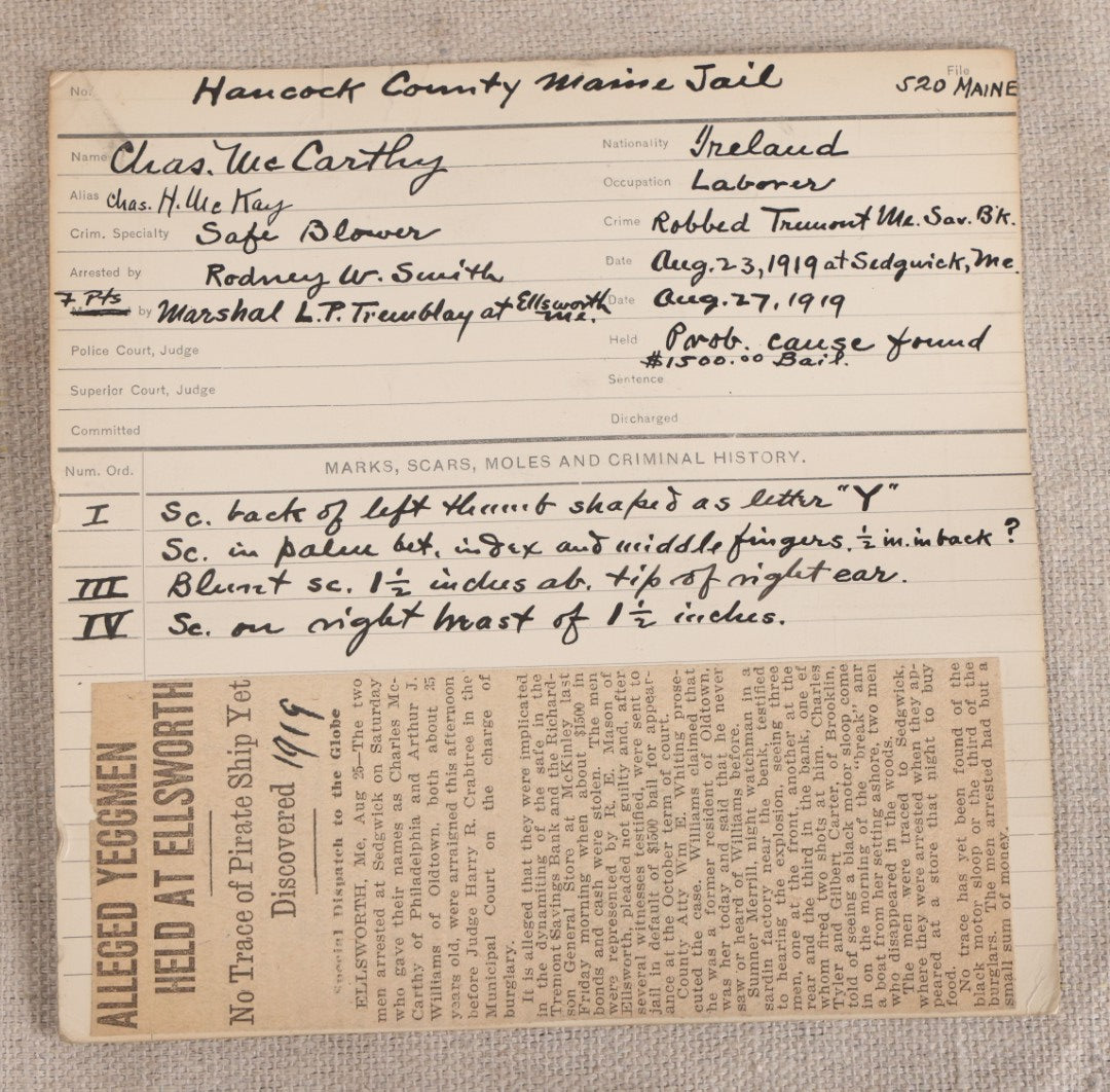 Lot 154 - Antique Real-Photo Police Mugshot And Arrest Card For Chas. McCarthy, Alias Chas. H. McKay, Yeggman, Criminal Specialty Safe Blower, Robbed Tremont Maine Savings Bank, Hancock County Maine Jail, 1919, With Fingerprints And Newspaper Clipping