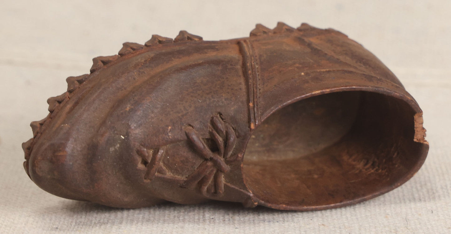 Lot 168 - Antique Folk Art Hand-Carved Wooden Shoe With Lace And Bow Detail And Scalloped Sole Edge