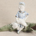 Lot 173 - Vintage Porcelain Figural Ashtray Of A Boy Riding An Alligator, 4-1/4" Height