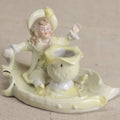 Lot 178 - Antique Porcelain Figural Vase With Girl Seated On A Leaf-Form Base, 3" Height