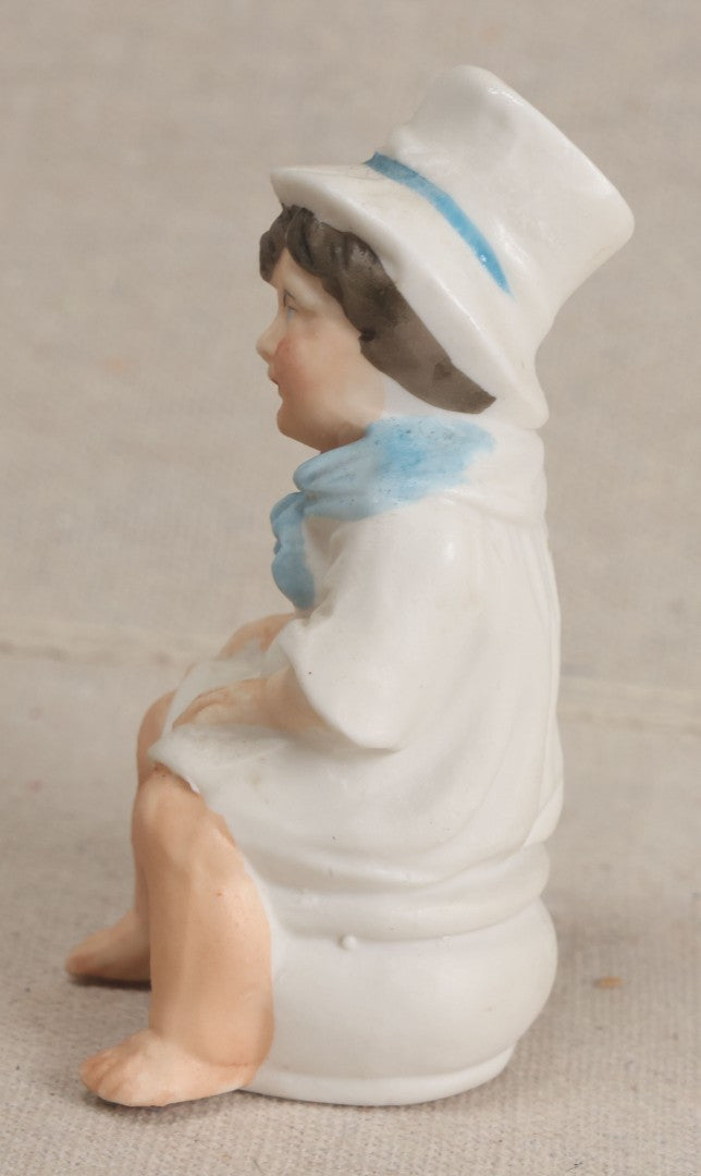 Lot 181 - Antique Bisque Figure of a Child With White Hat Seated on a Chamber Pot, Likely German