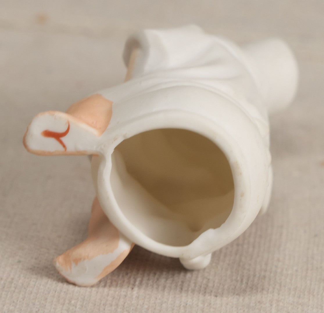 Lot 181 - Antique Bisque Figure of a Child With White Hat Seated on a Chamber Pot, Likely German