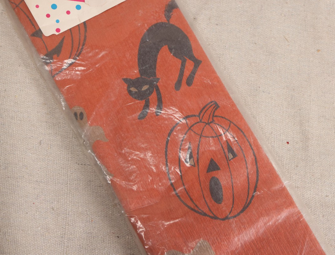 Lot 188 - Vintage Orange Dennison Halloween Flame Proof Crepe Paper With Black Cat, Jack-O-Lantern, And Gray Ghost Graphics In Original Packaging