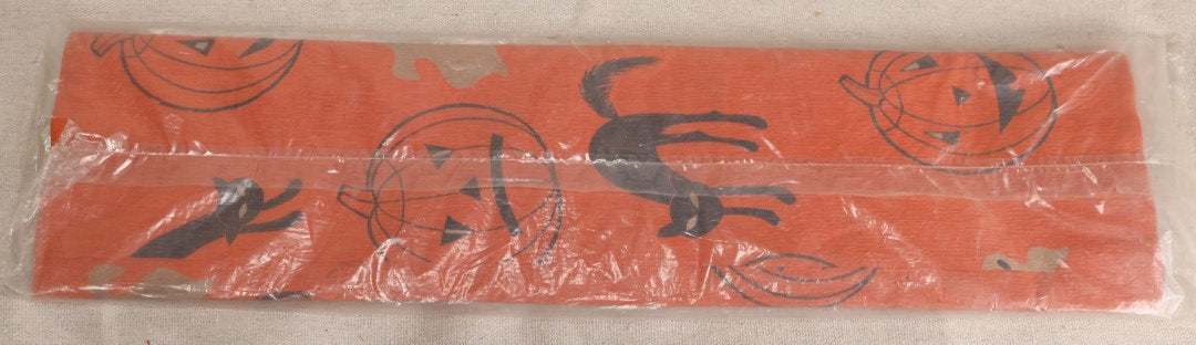 Lot 188 - Vintage Orange Dennison Halloween Flame Proof Crepe Paper With Black Cat, Jack-O-Lantern, And Gray Ghost Graphics In Original Packaging