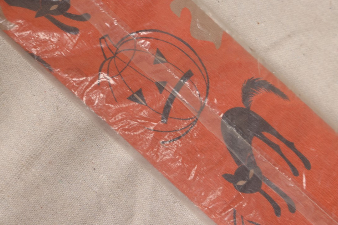 Lot 188 - Vintage Orange Dennison Halloween Flame Proof Crepe Paper With Black Cat, Jack-O-Lantern, And Gray Ghost Graphics In Original Packaging