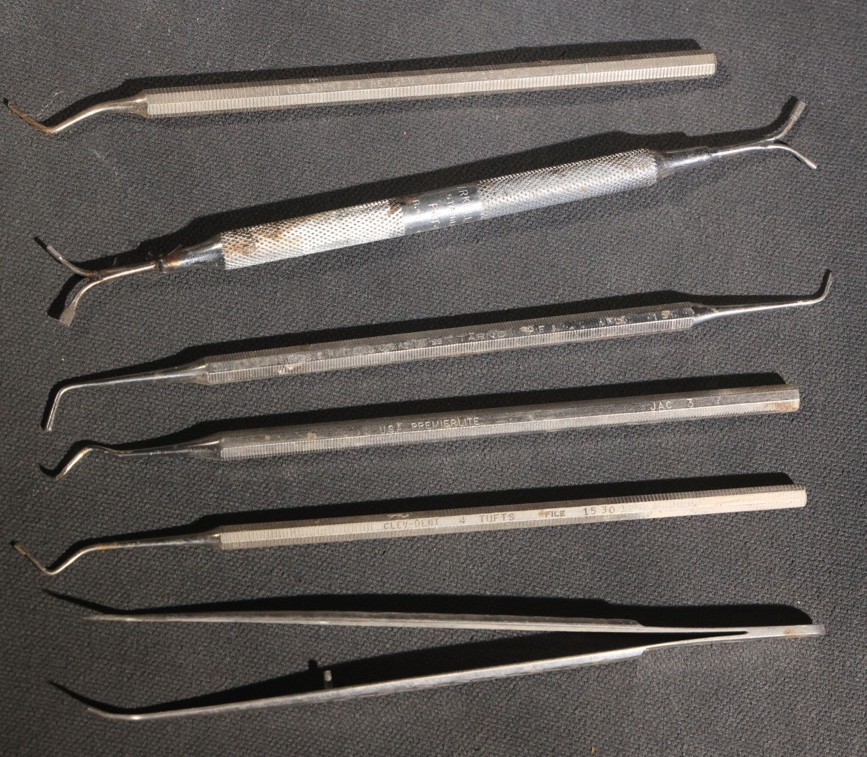 Lot 013 - Grouping Of Vintage Stainless Steel Dental Tools, Made In U.S.A.., Including Clev-Dent, Premierlite, S.S. White, And Kerr Examples, Scalers, Explorers, And Additional Instruments
