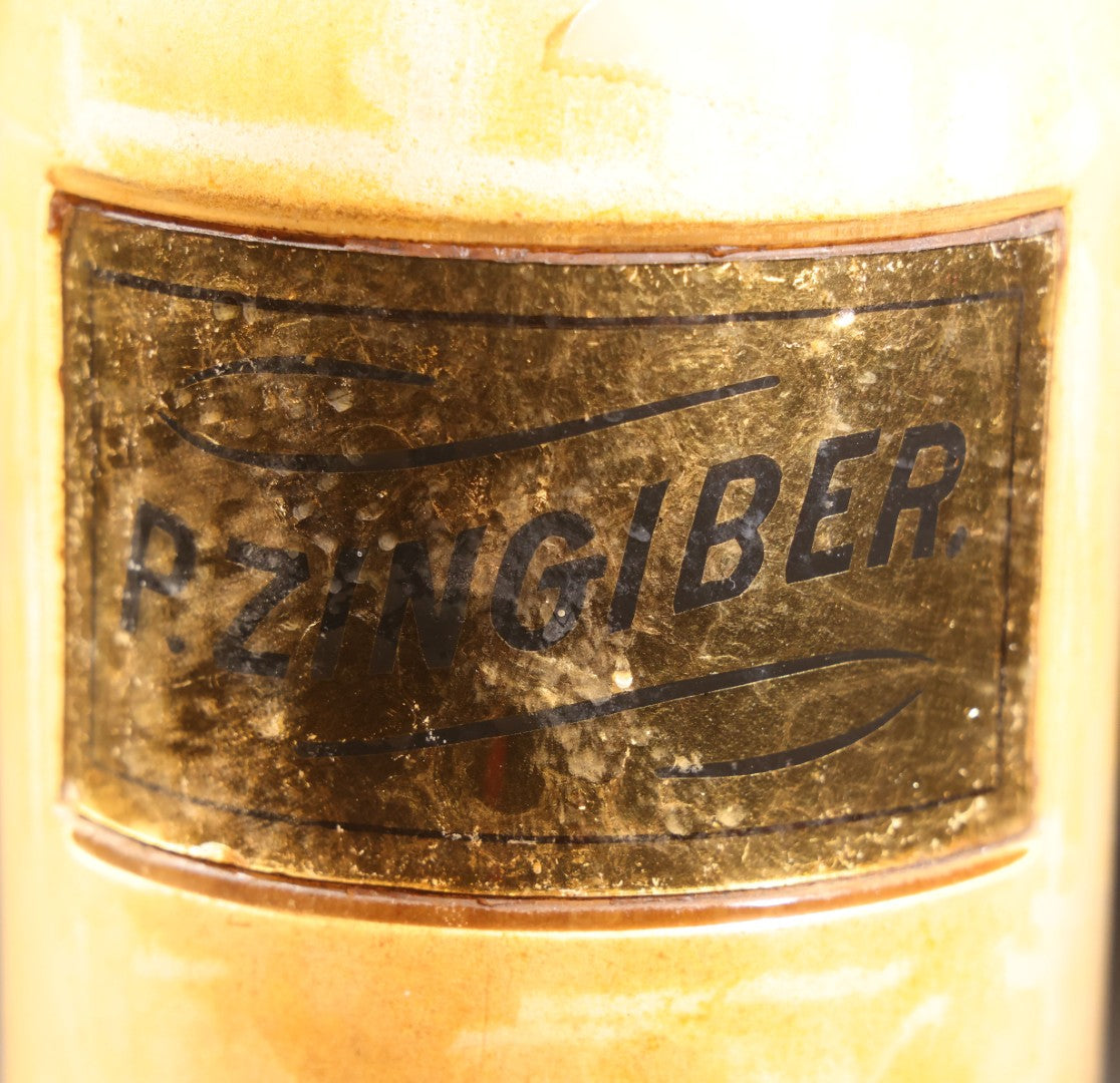 Lot 016 - Antique Apothecary Glass Jar, "P. Zingiber" (Powdered Ginger), Reverse-Painted Gold Glass Label, Glass Stopper, Manufactured By Whitall Tatum Company, U.S.A..