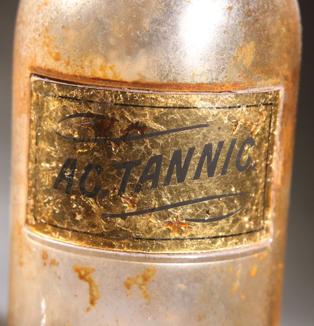 Lot 017 - Antique Apothecary Glass Jar, "Ac. Tannic" (Tannic Acid), Reverse-Painted Gold Glass Label, Glass Stopper, Manufactured By Whitall Tatum Company, U.S.A..