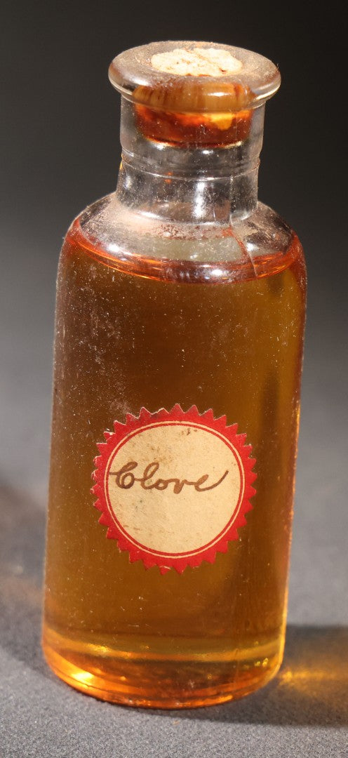 Lot 018 - Grouping Of Six Vintage Glass Flavoring Oil Extract Bottles With Contents Including Anise, Lemon, Lime, Clove, Orange, And Sassafras