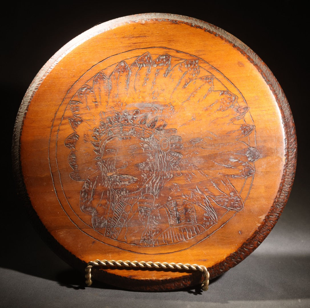 Lot 026 - Antique Pyrography Wood Plaque, Portrait Of A Native American Figure In War Bonnet, Chip-Carved Border, 13-3/8" x 13-1/8"