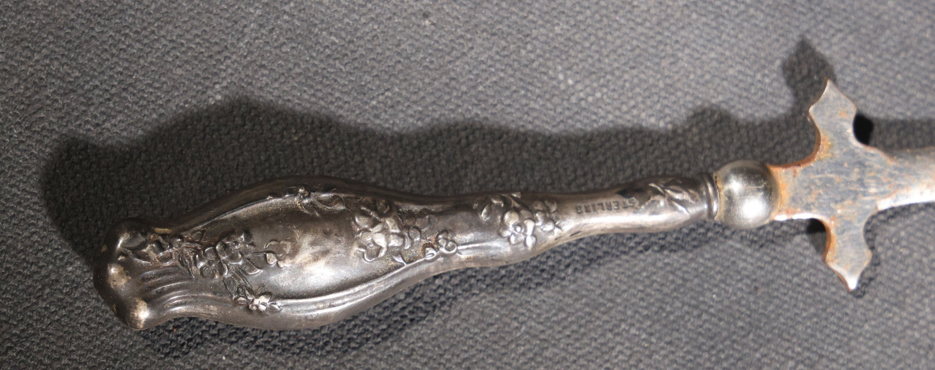 Lot 029 - Antique Sterling Silver-Handled Sword-Form Letter Opener With Floral Repousse Handle And Cross Guard