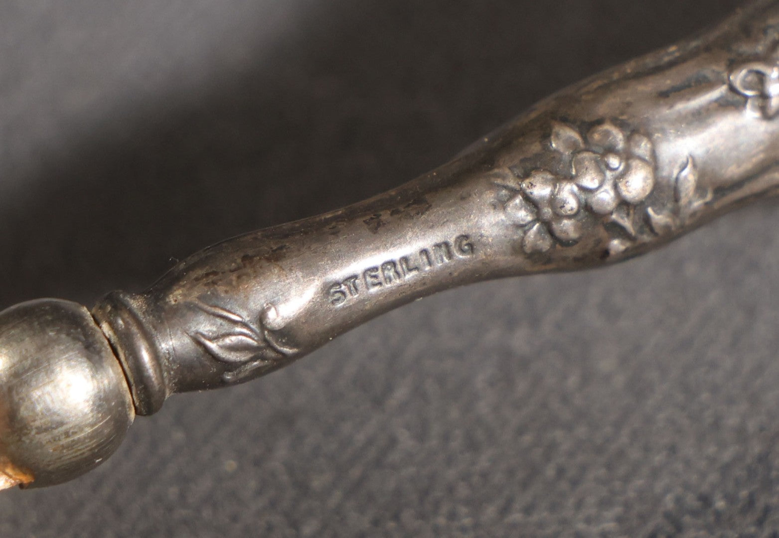Lot 029 - Antique Sterling Silver-Handled Sword-Form Letter Opener With Floral Repousse Handle And Cross Guard