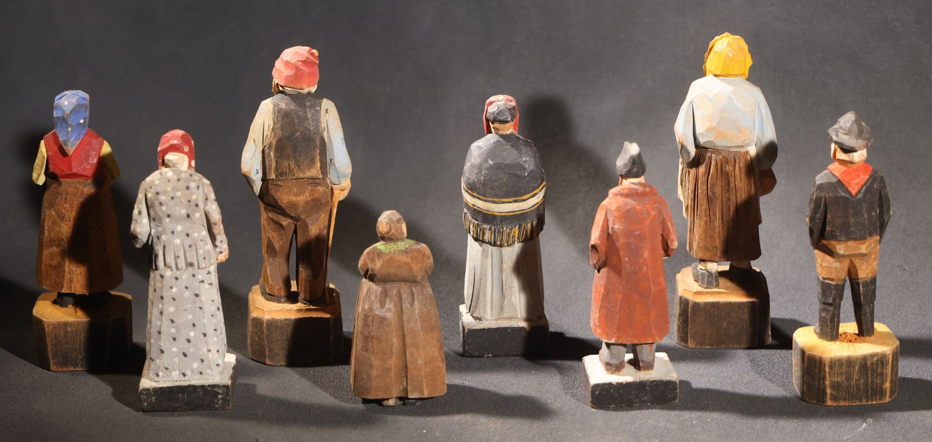 Lot 034 - Grouping Of Eight Vintage Folk Art Hand-Carved And Painted Wooden Figures In Traditional Dress
