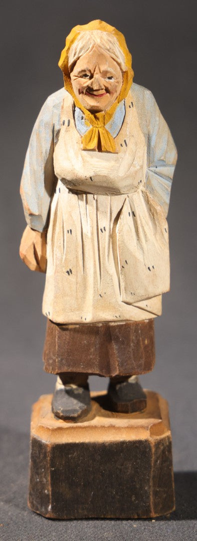 Lot 034 - Grouping Of Eight Vintage Folk Art Hand-Carved And Painted Wooden Figures In Traditional Dress