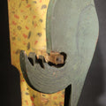 Lot 035 - Antique Folk Art Painted Green Scroll-Cut Wooden Wall-Mounted Parrot On Yellow Spatter-Painted Backboard, 11" H