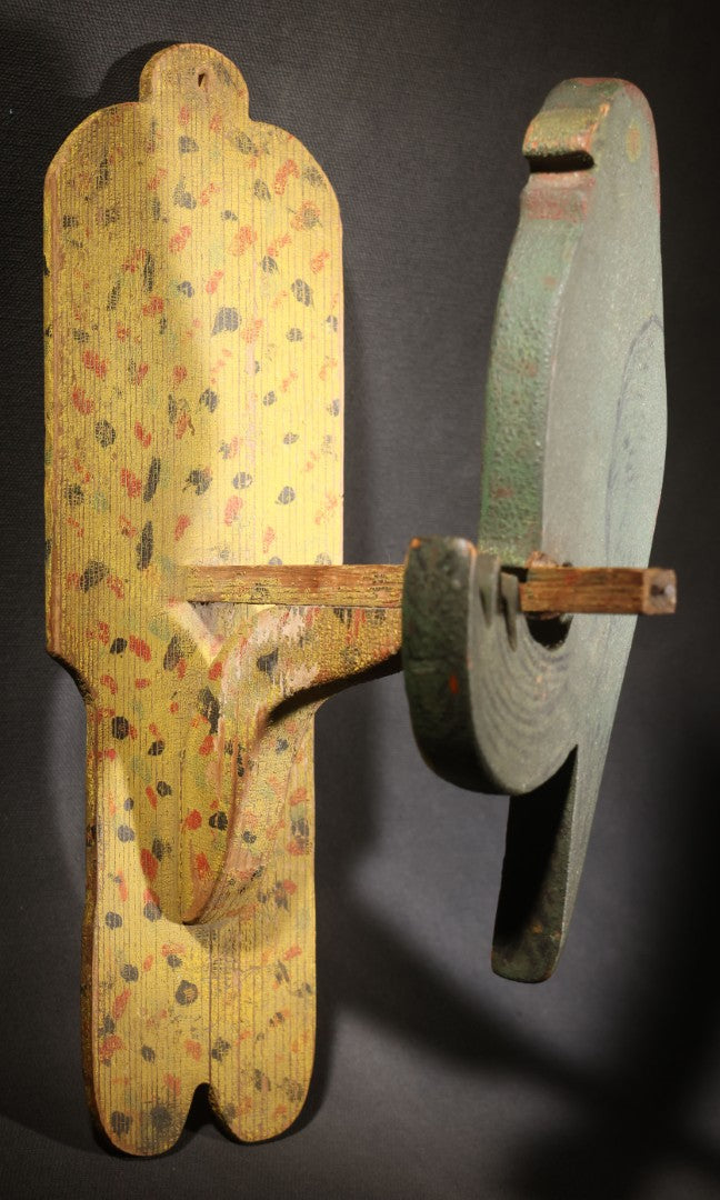 Lot 035 - Antique Folk Art Painted Green Scroll-Cut Wooden Wall-Mounted Parrot On Yellow Spatter-Painted Backboard