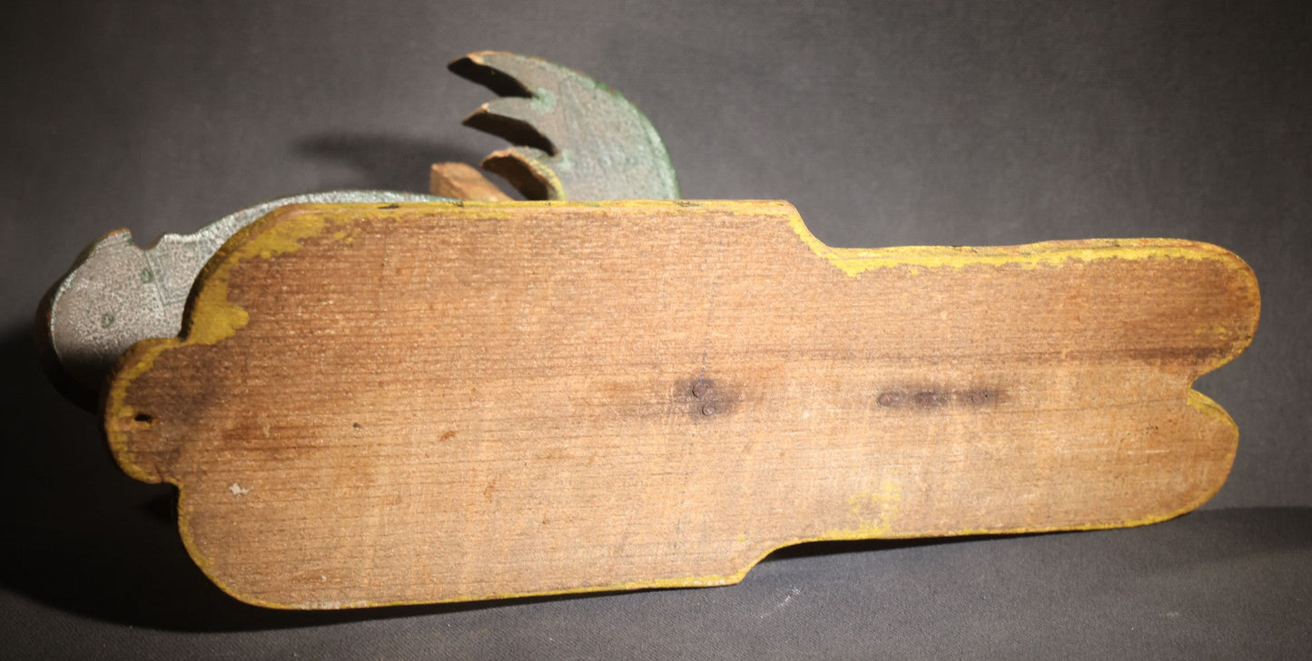 Lot 035 - Antique Folk Art Painted Green Scroll-Cut Wooden Wall-Mounted Parrot On Yellow Spatter-Painted Backboard
