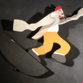 Lot 039 - Vintage Folk Art Painted Wood Clown Whirligig, Red Hair, Black Hat, Yellow Trousers, Paddle Arms, On Dark Green Crescent Base, 10-5/8" H