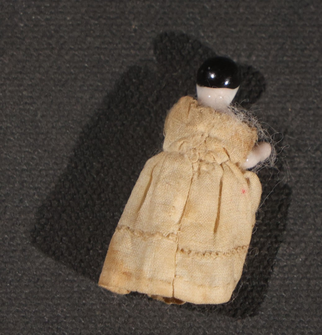 Lot 045 - Pair Of Antique Miniature Frozen Charlotte Dolls, One Porcelain In Cloth Gown And One Bisque