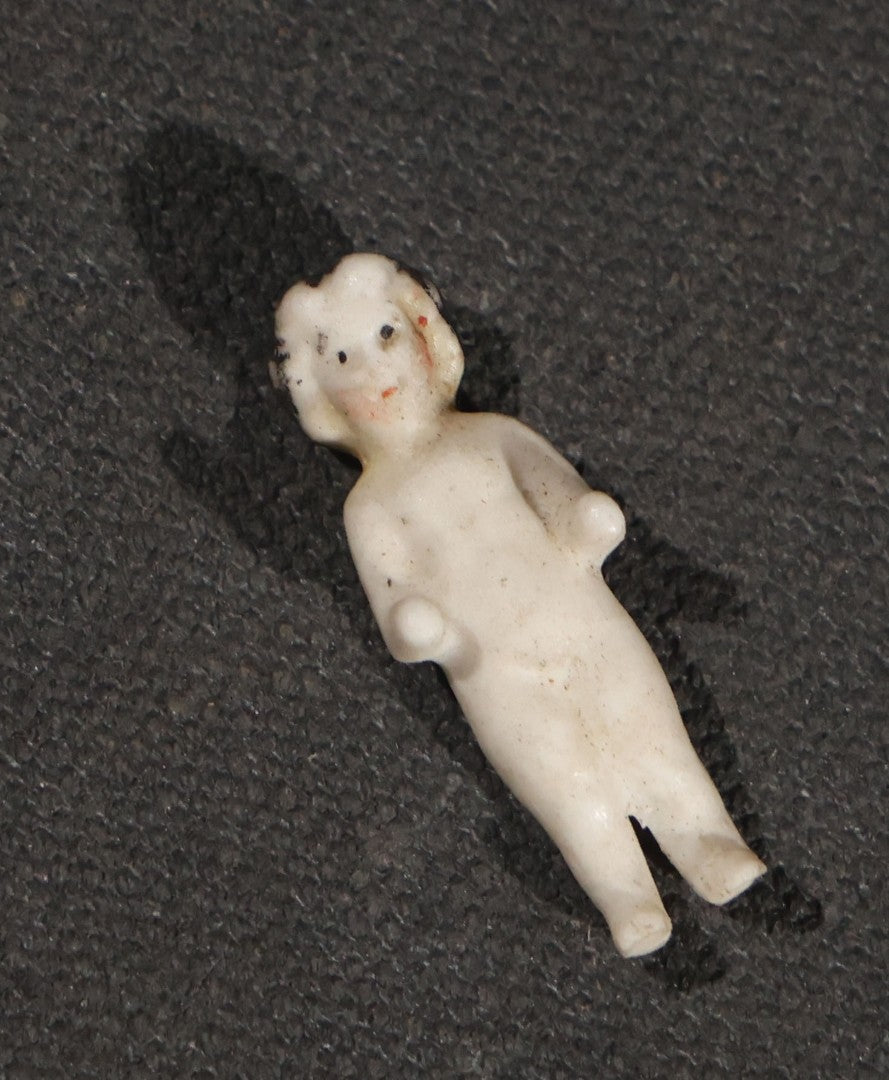 Lot 045 - Pair Of Antique Miniature Frozen Charlotte Dolls, One Porcelain In Cloth Gown And One Bisque