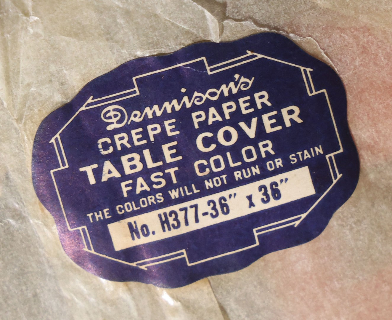Lot 046 - Antique Dennison's Halloween Crepe Paper Table Cover No. H377 With Black Cat, Witch, Owl, Moon, And J.O.L. Graphics, In Original Envelope, Dennison Manufacturing Co., Framingham, Massachusetts