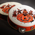 Lot 048 - Pair Of Vintage Halloween Tin Lithograph Toy Tambourine Noisemakers With Jack-O-Lantern J.O.L. And Costume Parade Graphics, U.S. Metal Toy Mfg. Co., Made In U.S.A..