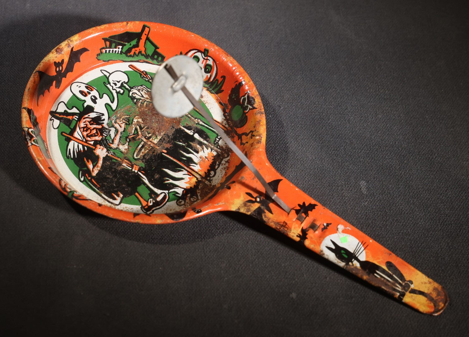 Lot 049 - Pair Of Vintage Halloween Tin Lithograph Paddle Noisemakers, T. Cohn Inc. Jack-O-Lantern J.O.L. And Witch Woman, And U.S. Metal Toy Mfg. Co. Witch, Ghost, Black Cat, And Haunted House