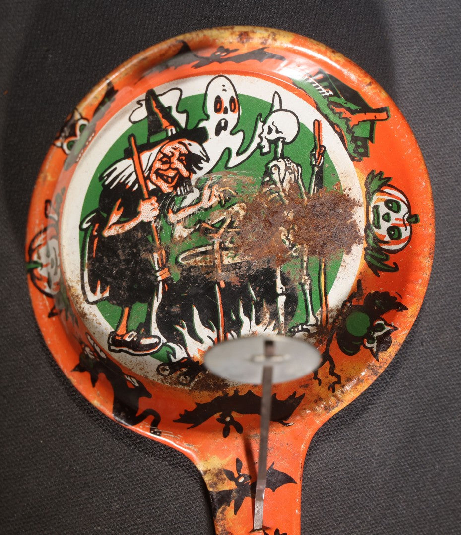 Lot 049 - Pair Of Vintage Halloween Tin Lithograph Paddle Noisemakers, T. Cohn Inc. Jack-O-Lantern J.O.L. And Witch Woman, And U.S. Metal Toy Mfg. Co. Witch, Ghost, Black Cat, And Haunted House