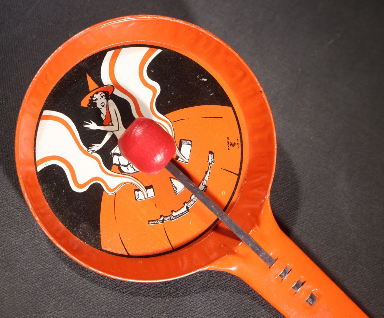 Lot 049 - Pair Of Vintage Halloween Tin Lithograph Paddle Noisemakers, T. Cohn Inc. Jack-O-Lantern J.O.L. And Witch Woman, And U.S. Metal Toy Mfg. Co. Witch, Ghost, Black Cat, And Haunted House