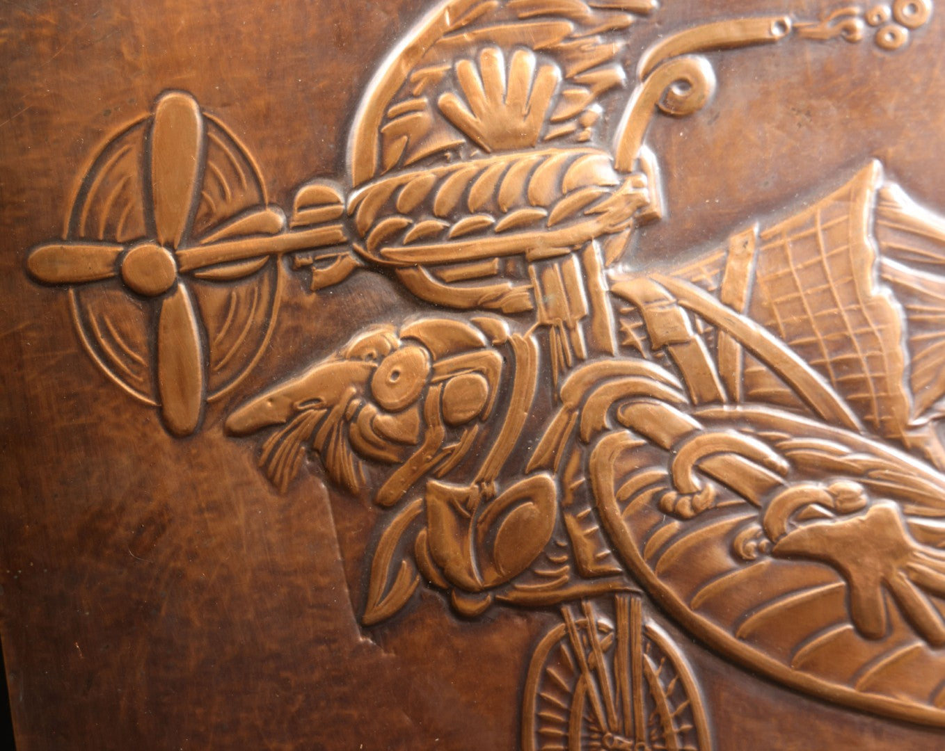 Lot 051 - Vintage Copper Repoussé Plaque On Plywood, Fantastical Winged Figure On Unicycle With Propeller, Signed And Dated 1969, Gifted From Reck, Germany, 1972, 9-1/4" x 13"