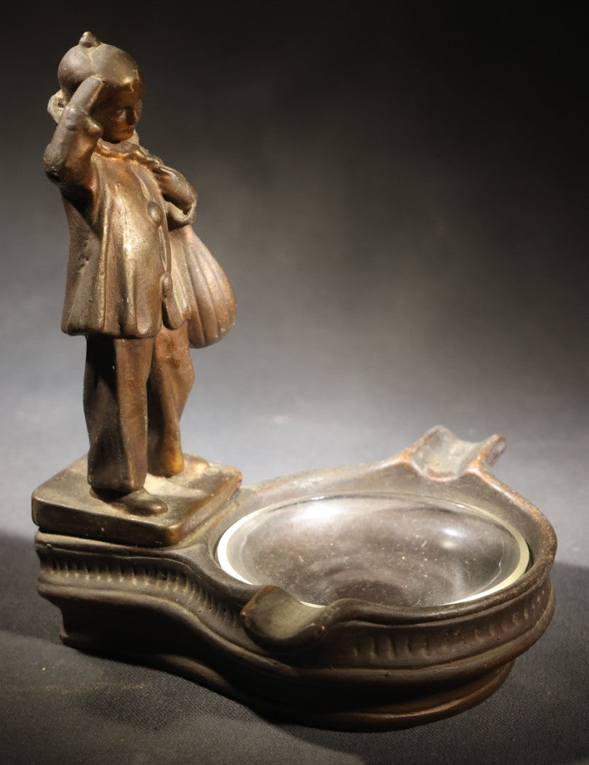 Lot 052 - Antique Copper-Clad Composition Figural Ashtray, Standing Pierrot Clown Holding A Lute, Glass Tray Insert, 6-5/8" H