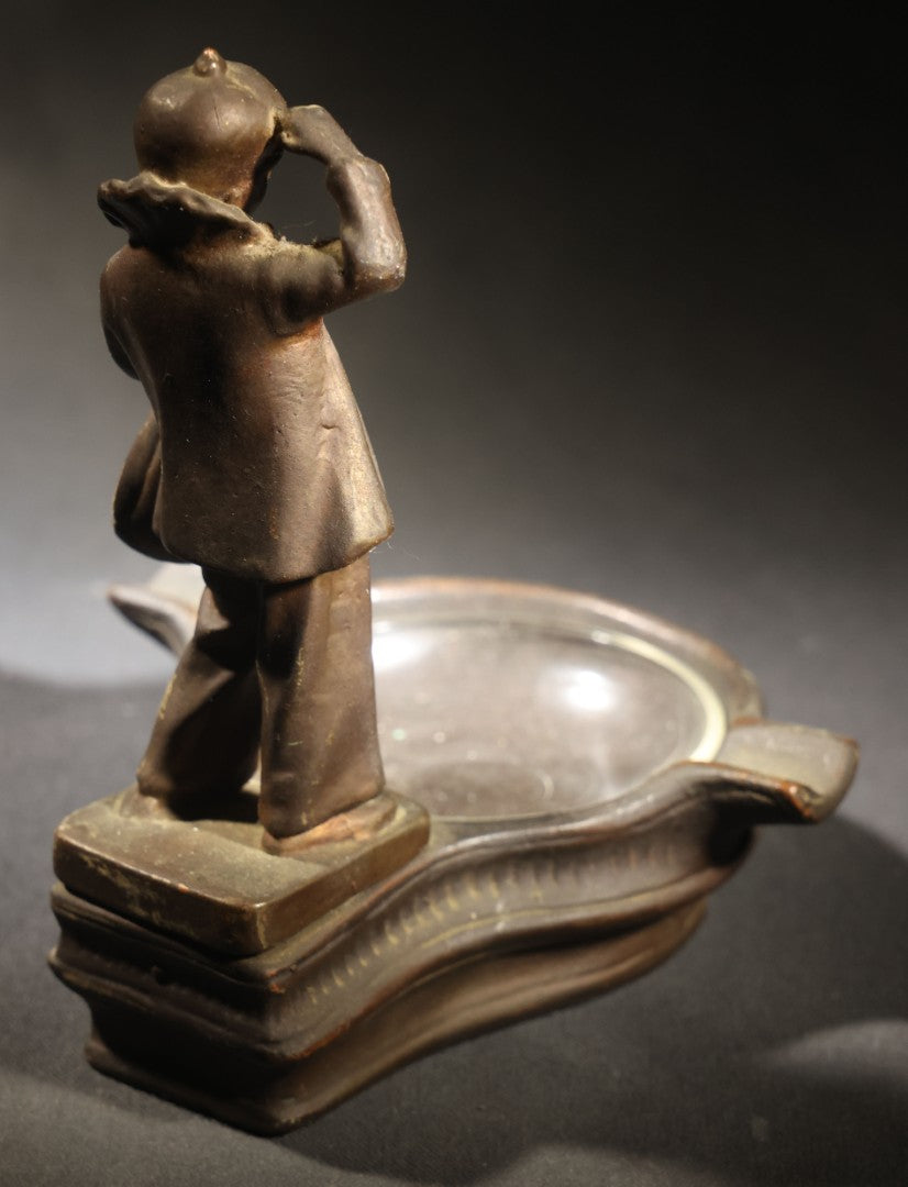 Lot 052 - Antique Copper-Clad Composition Figural Ashtray, Standing Pierrot Clown Holding A Lute, Glass Tray Insert, 6-5/8" H