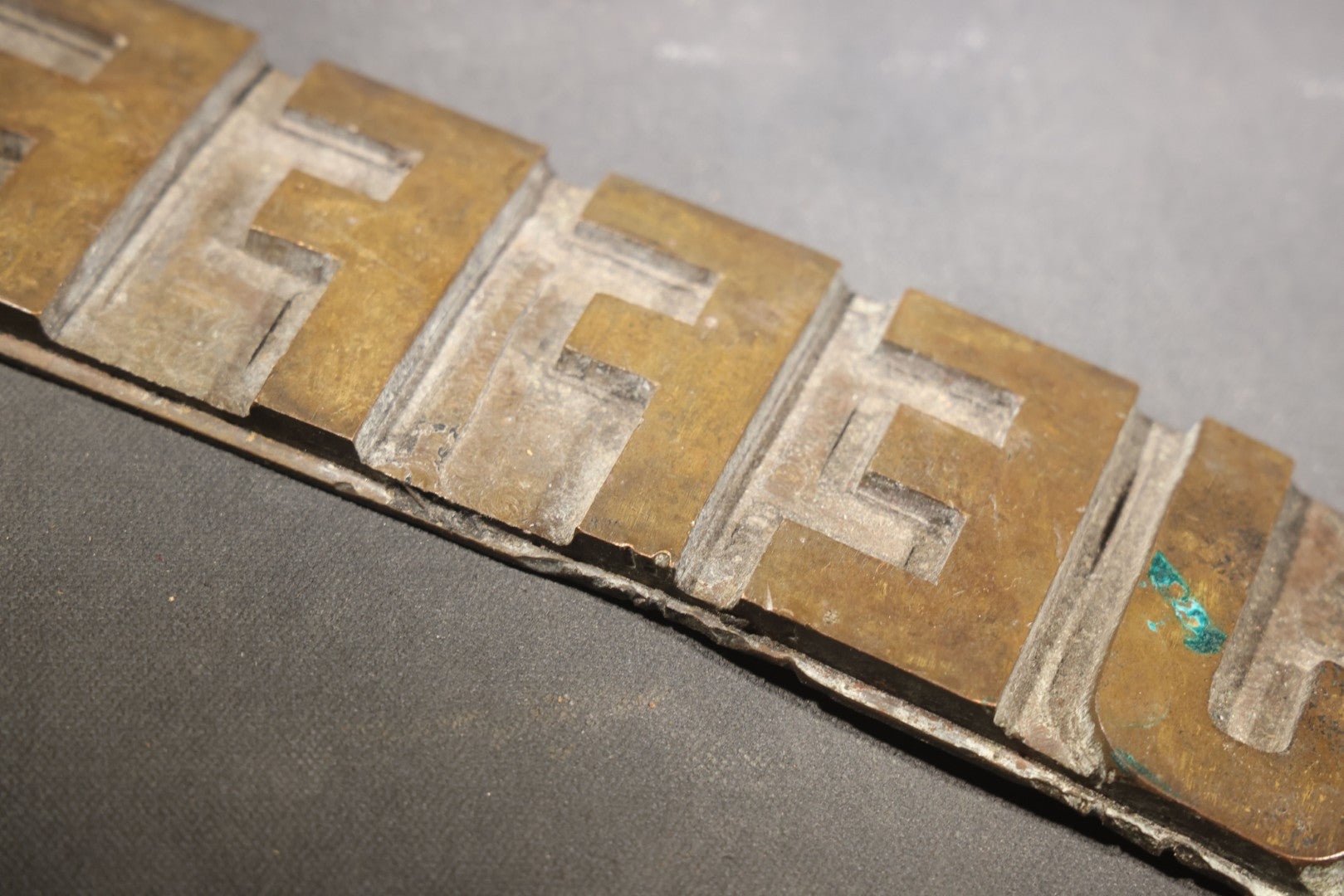 Lot 057 - Antique Bronze Printing Plate, "Jefferson" In Relief Block Letters, Milled Surface, Bowed, 16-1/4" L