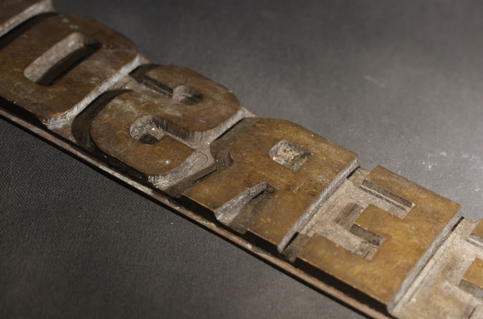 Lot 057 - Antique Bronze Printing Plate, "Jefferson" In Relief Block Letters, Milled Surface, Bowed, 16-1/4" L