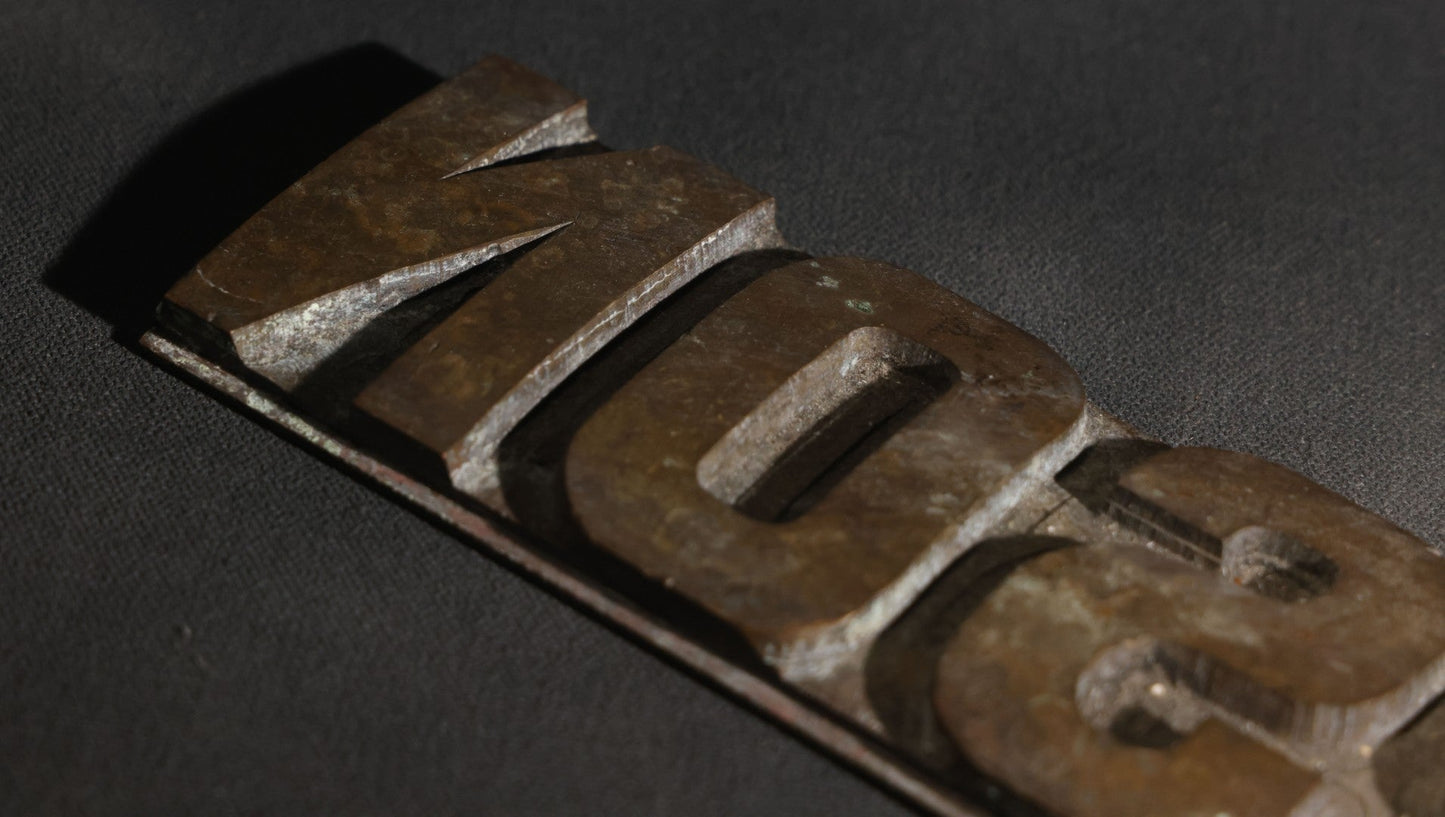 Lot 057 - Antique Bronze Printing Plate, "Jefferson" In Relief Block Letters, Milled Surface, Bowed, 16-1/4" L