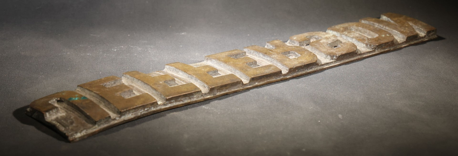 Lot 057 - Antique Bronze Printing Plate, "Jefferson" In Relief Block Letters, Milled Surface, Bowed, 16-1/4" L