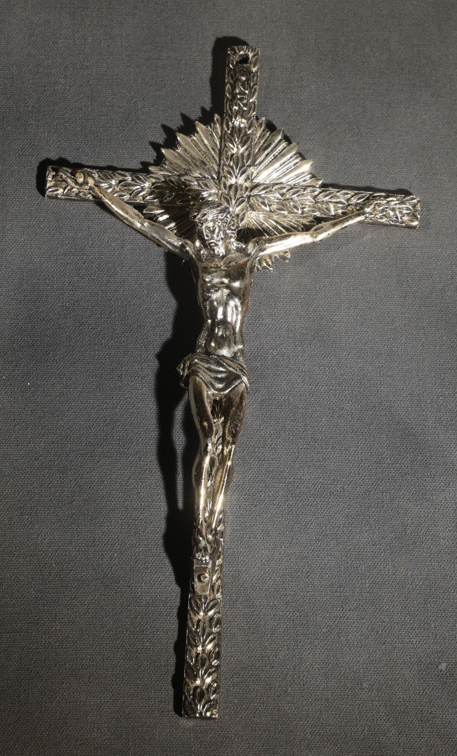 Lot 063 - Pair Of Vintage Metal Crucifixes, One Silver-Toned With Foliate Halo And One Gold-Toned With Red Cabochons And Enamel Inlay