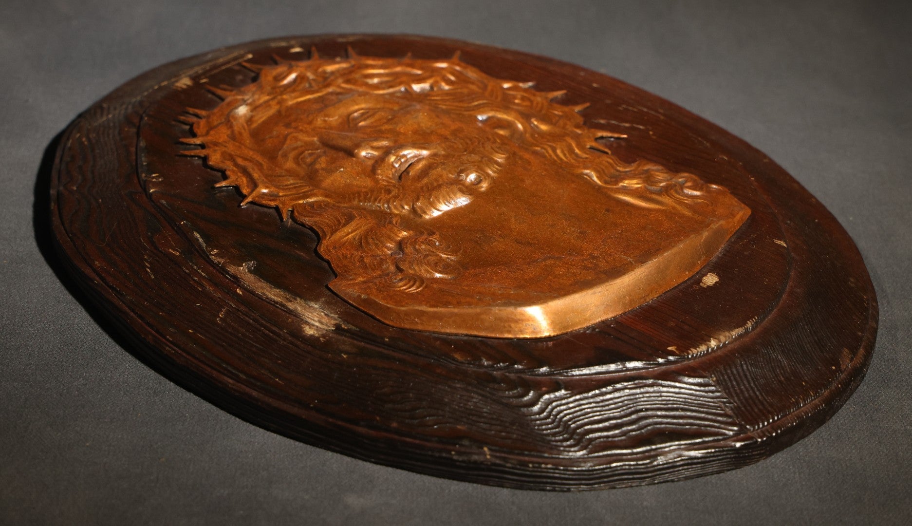 Lot 070 - Vintage Oval Wood Plaque With Gold-Toned Metal Relief Bust Of Christ Wearing Crown Of Thorns