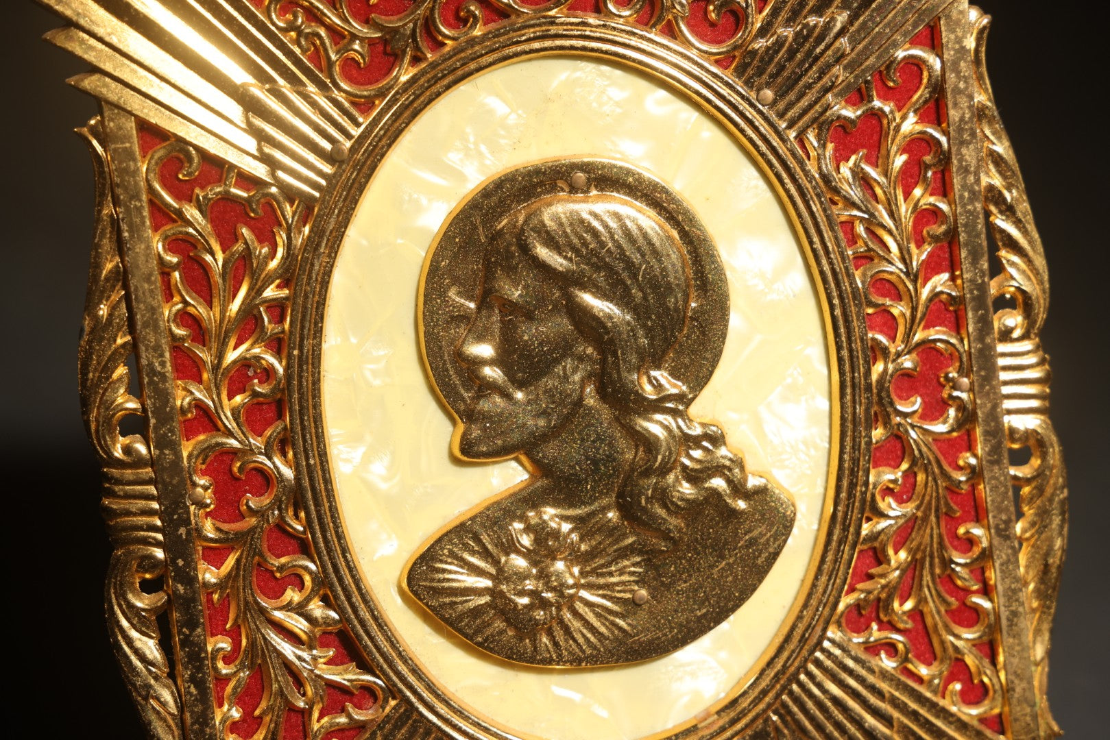 Lot 073 - Vintage Gold-Toned Metal Wall Plaque With Sacred Heart Of Jesus Profile Relief, Red Velvet Backing, Scrollwork Frame, Original Tag